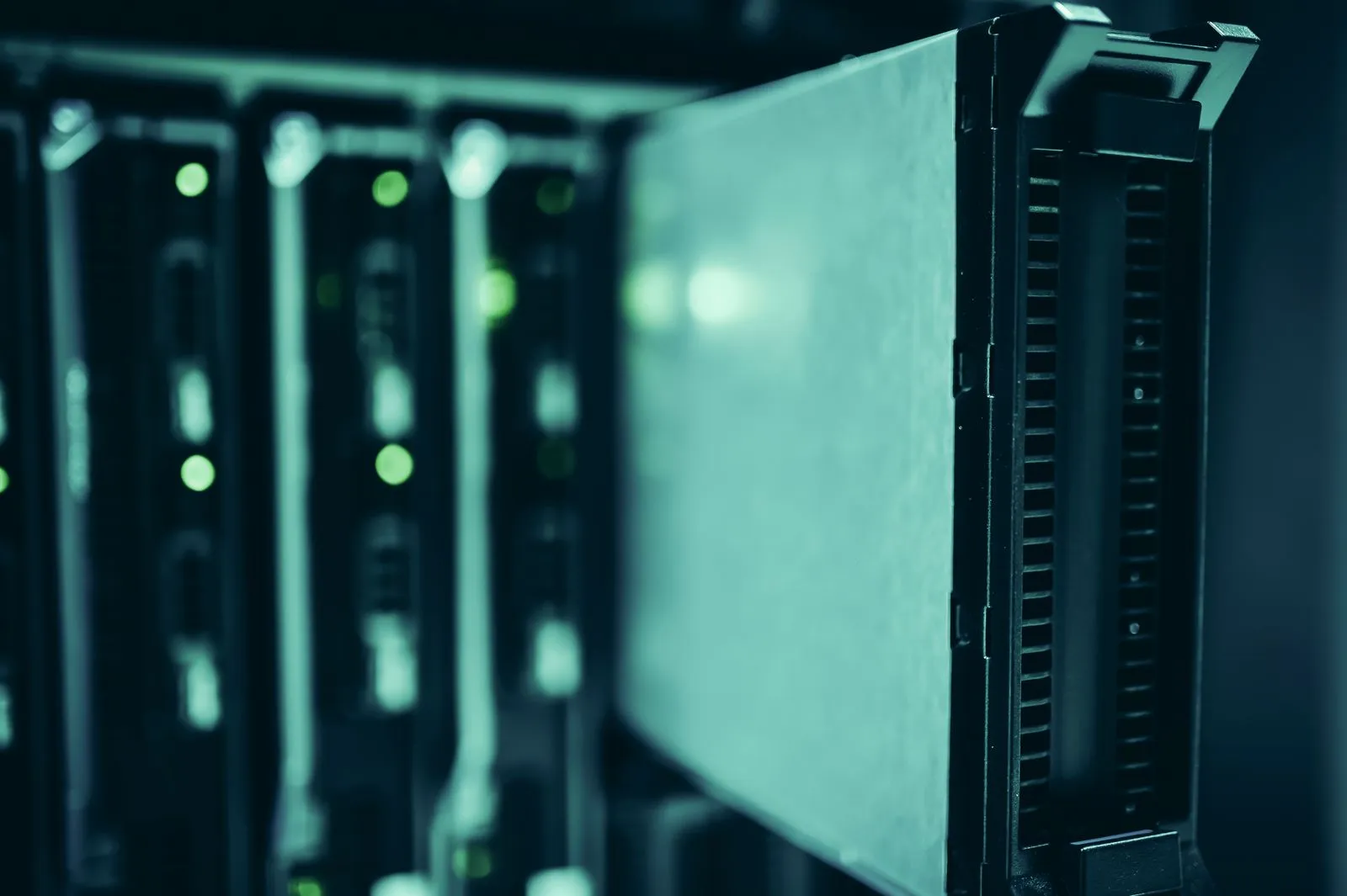 Rows of illuminated server racks inside a data centre.