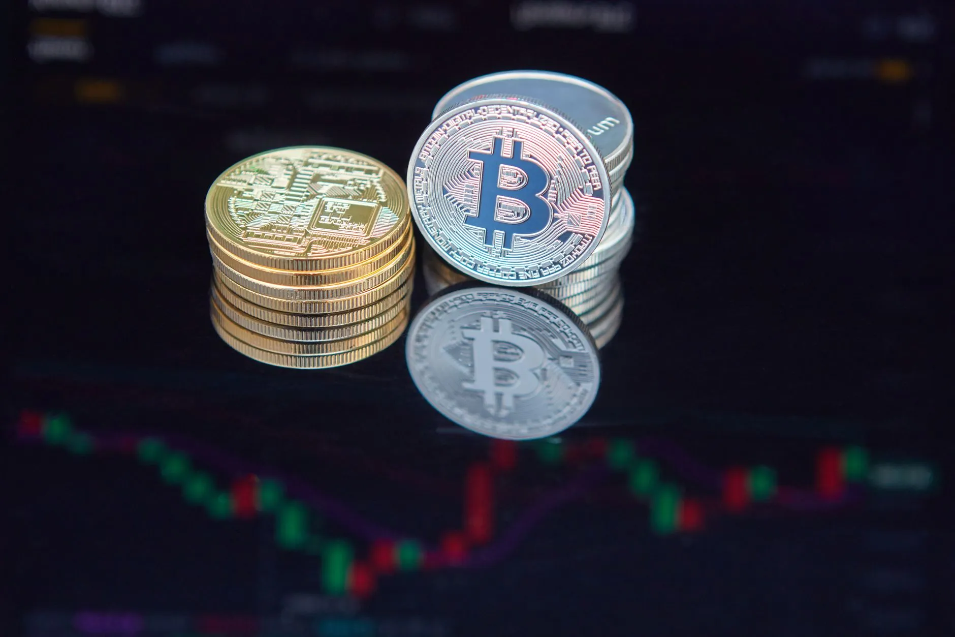 A bitcoin token beside rising financial charts, illustrating record ETF inflows in August.