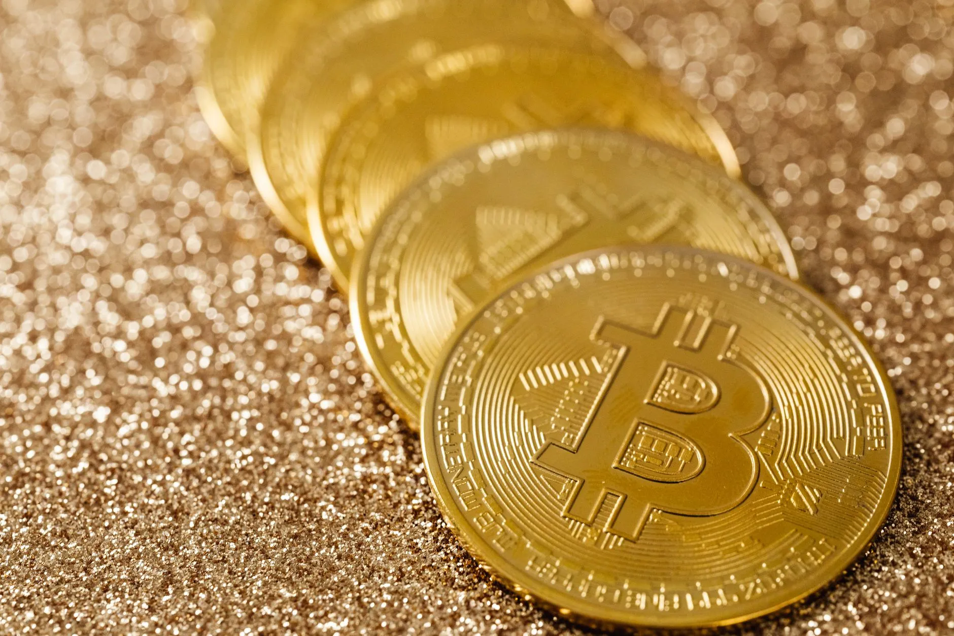A close-up of gold coins, representing bitcoin ETF inflows and institutional demand.