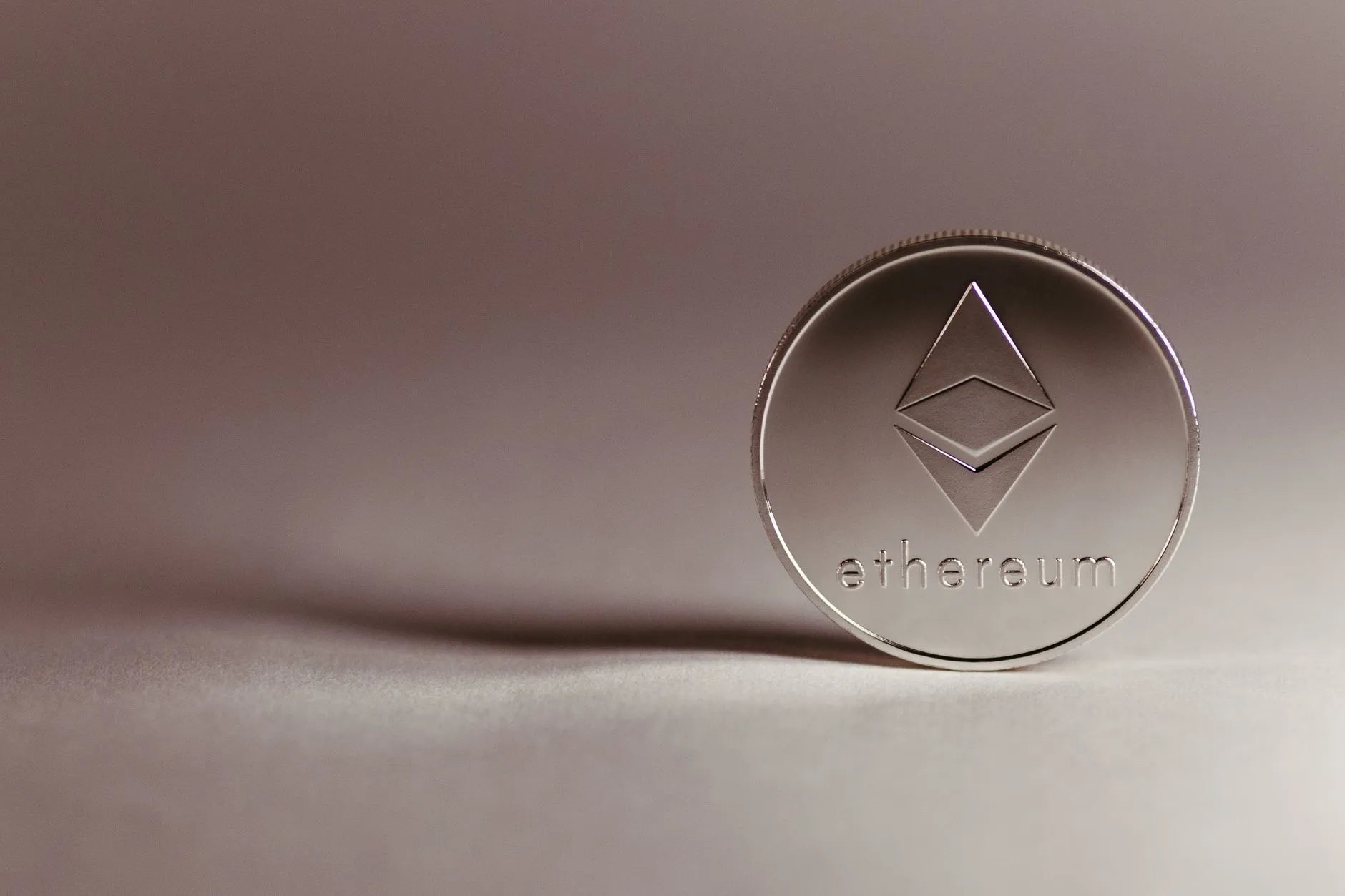 The ethereum symbol rendered in light, illustrating rising ether ETF inflows.