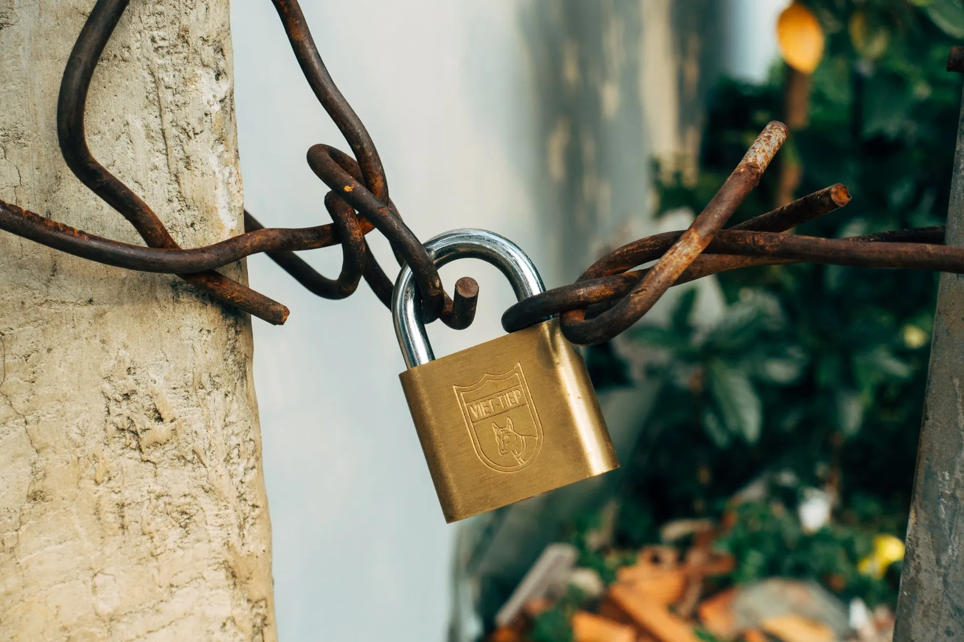 A padlock and chain, symbolizing token locks and scheduled unlocks creating supply overhang.